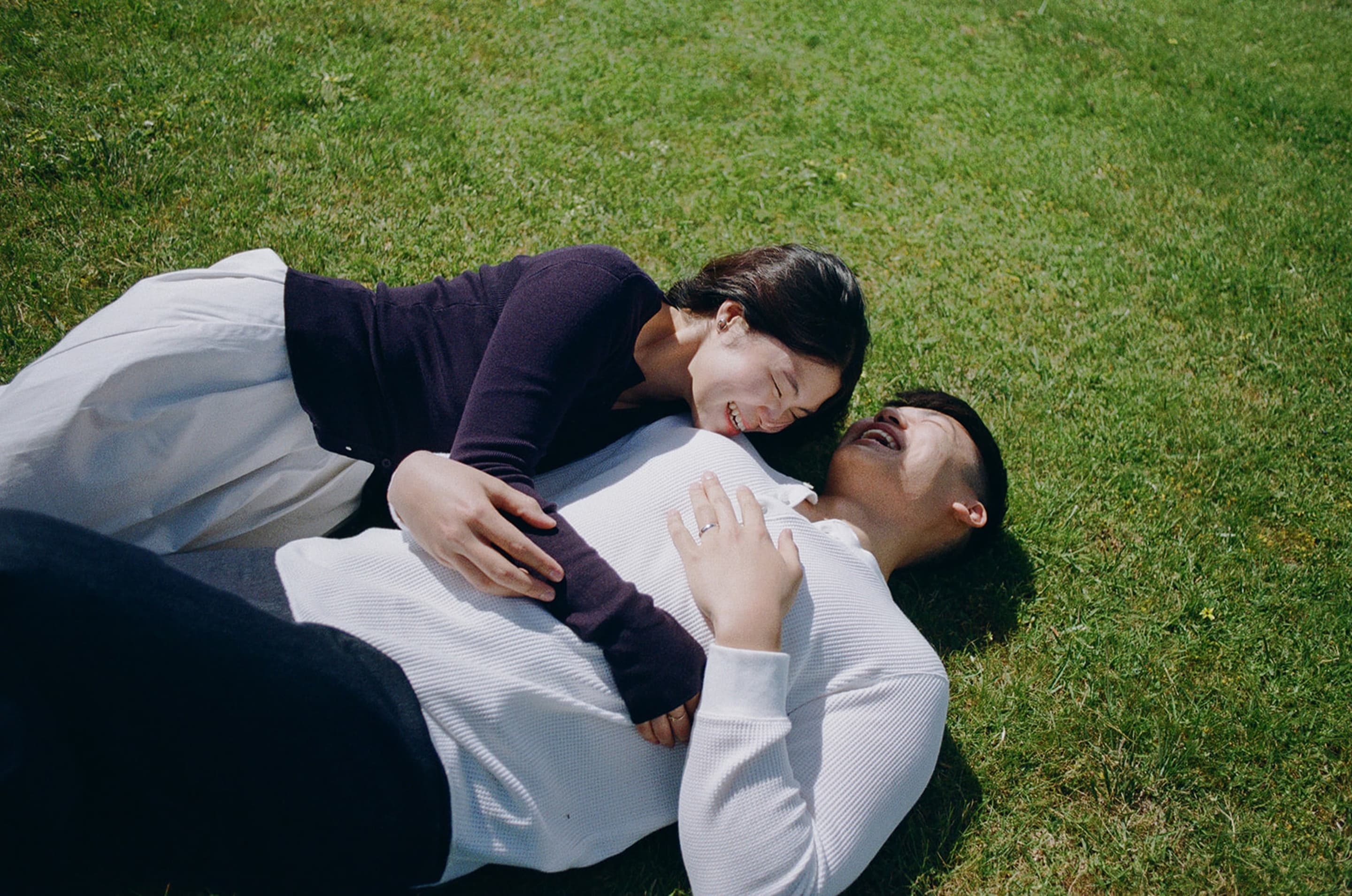 Kobe and Chesqa lying on the grass